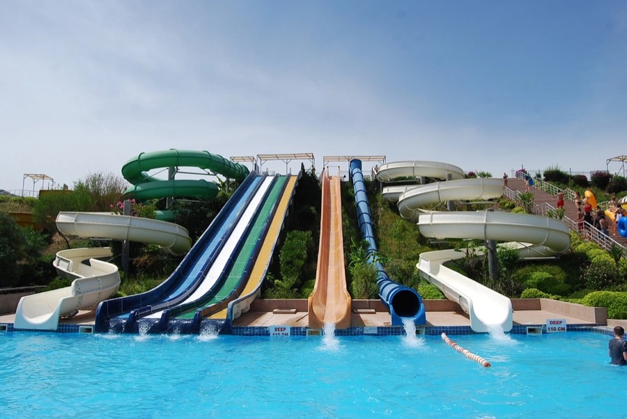 Multicoloured water-park slides on a summer day